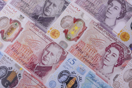 Britain paper money, pound sterling, cash banknotes for financial and business transactions. Britain...