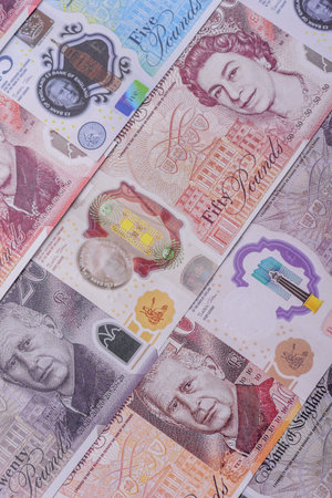 Britain paper money, pound sterling, cash banknotes for financial and business transactions. Britain...