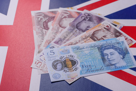 Britain paper money, pound sterling, cash banknotes for financial and business transactions. Britain money as a background for your designの写真素材