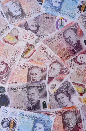 Britain paper money, pound sterling, cash banknotes for financial and business transactions. Britain money as a background for your designの写真素材