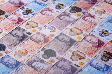 Britain paper money, pound sterling, cash banknotes for financial and business transactions. Britain...