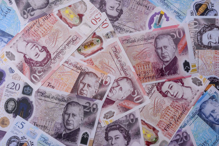 Britain paper money, pound sterling, cash banknotes for financial and business transactions. Britain money as a background for your designの写真素材