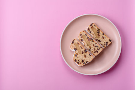Stollen, a German Christmas pastry and dessert with fruit and marzipan, is perfect for the winter holiday table. Stollen as a food background for your designの写真素材