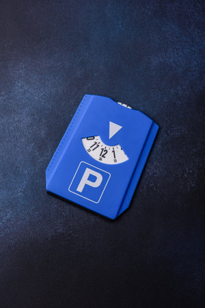 A parking disc, permit, or ticket for measuring time and paying municipal services. A parking disc as a background for your designの写真素材