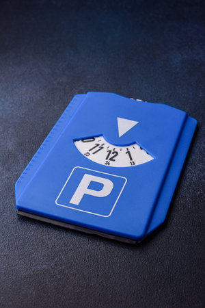 A parking disc, permit, or ticket for measuring time and paying municipal services. A parking disc as a background for your designの写真素材