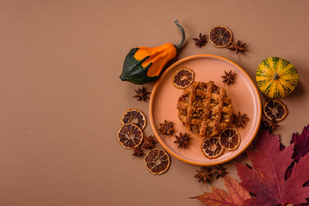 Apple or pumpkin pie or tart is a sweet American autumn treat. American apple pie as a food background for your designの写真素材