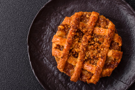 Apple or pumpkin pie or tart is a sweet American autumn treat. American apple pie as a food background for your designの写真素材