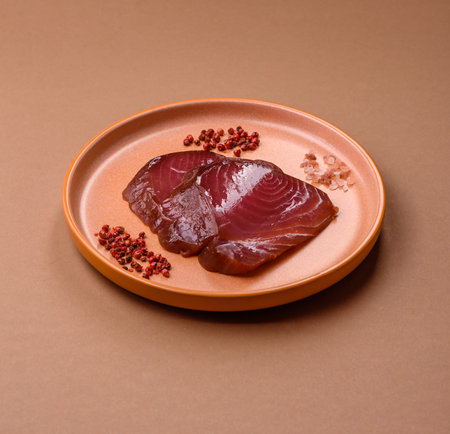 Tuna steak for sashimi or sushi, smoked fish. Tuna steak as a food background for your design