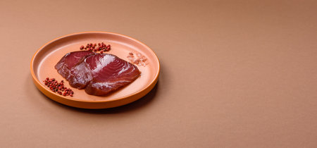 Tuna steak for sashimi or sushi, smoked fish. Tuna steak as a food background for your design