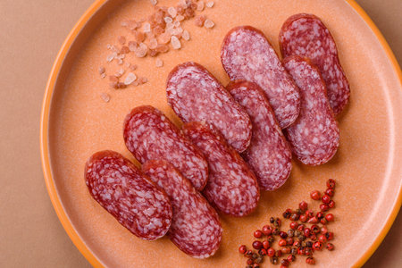 Smoked salami slices, beef or chicken sausage for sandwiches. Salami slices for food backgroundの写真素材