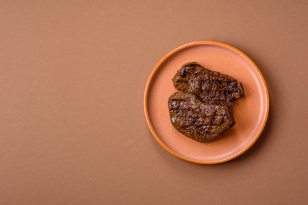 Food, grilled beef steak, roast meat for lunch. Grilled beef steak as a food background for your design.の写真素材