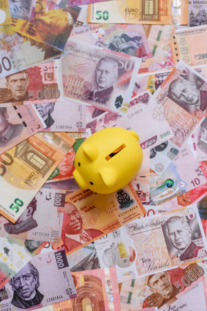 A piggy bank as a concept for storing, accumulating, and saving financial resources. A piggy bank as a financial backdrop for your design.の写真素材