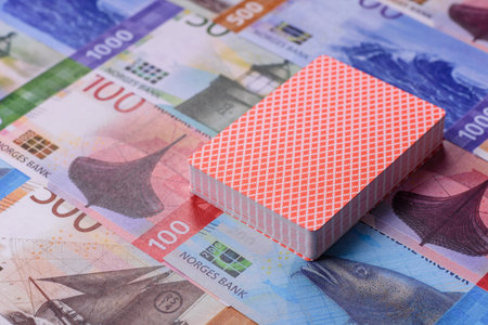 Casino game in the Norway, Norwegian krone money, chips, cards and other attributes. Gambling in casinos in the Norway as a background for your designの写真素材