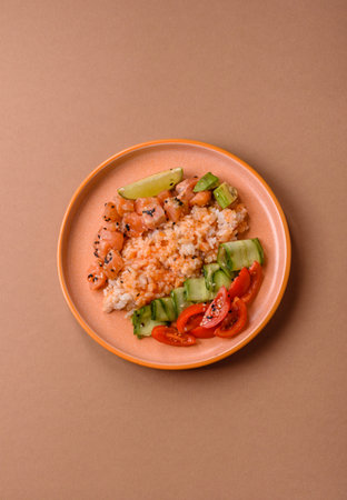 A food bowl with salmon, rice, avocado, tomatoes, and cucumbers. A salmon bowl as a food background...