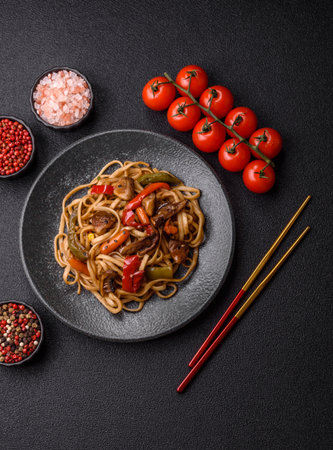 Asian food, noodles with vegetables, vegetarian dish with spicy sauce. Noodles with vegetables as a food background for your designの写真素材