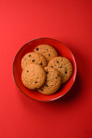 Food, oatmeal chocolate raisin cookies, dessert or breakfast pastry. Oatmeal chocolate cookies as a food background for your designの写真素材