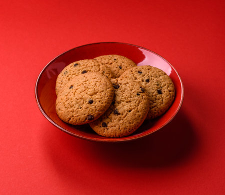 Food, oatmeal chocolate raisin cookies, dessert or breakfast pastry. Oatmeal chocolate cookies as a food background for your designの写真素材