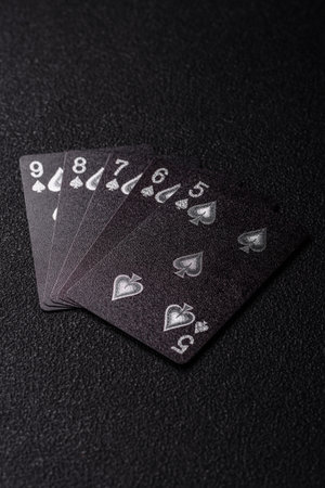 Playing card game poker with cards on black felt as background for your design