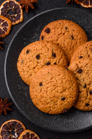 Food, oatmeal chocolate raisin cookies, dessert or breakfast pastry. Oatmeal chocolate cookies as a food background for your designの写真素材
