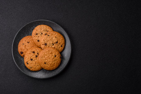 Food, oatmeal chocolate raisin cookies, dessert or breakfast pastry. Oatmeal chocolate cookies as a food background for your designの写真素材