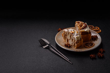 a sweet cinnamon pastry, a high calorie bun or roll. with cinnamon as a food background for your designの写真素材