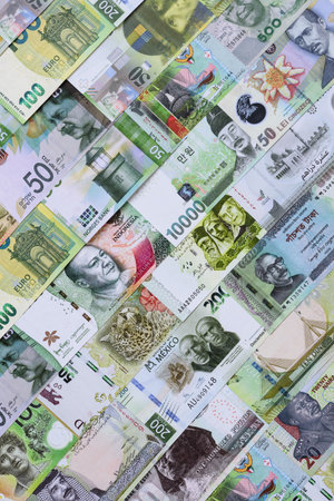 Money background, currency exchange, paper banknotes from different countries. Money cash currency as a financial background for your designの写真素材