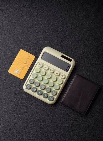 Calculator, money and expense calculations, tax form completion, and business budget concept preparation. Calculator, expense calculations as a financial background for your designの写真素材