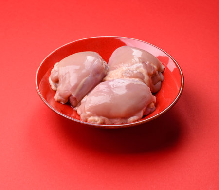 Chicken thigh fillet, skinless and boneless meat for grilling or barbecue.の写真素材