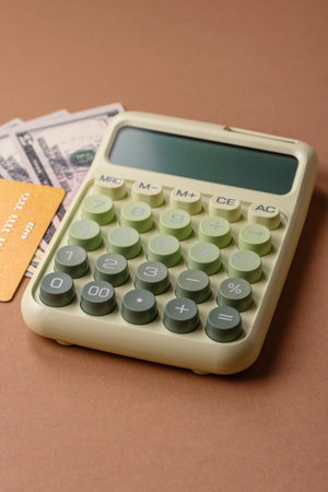 Calculator, money and expense calculations, tax form completion, and business budget concept preparation. Calculator, expense calculations as a financial background for your designの写真素材