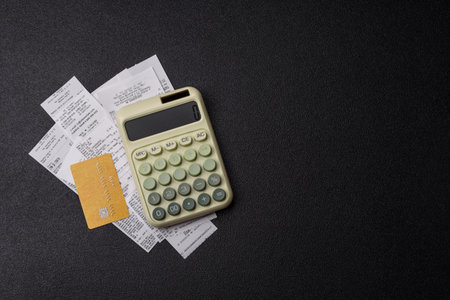 Calculator, money and expense calculations, tax form completion, and business budget concept preparation. Calculator, expense calculations as a financial background for your designの写真素材