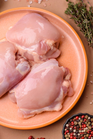 Chicken thigh fillet, skinless and boneless meat for grilling or barbecue. Chicken thigh fillet as a food background for your designの写真素材