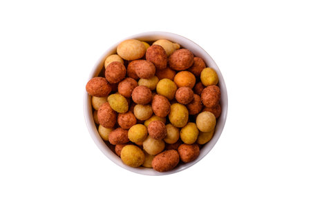 Food, nuts coated with salt and paprika. Salted peanuts coated with paprika as a food background for...