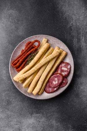 Grissini breadsticks, an Italian wheat pastry, are a great lunch snack. Grissini breadsticks as a food background for your designの写真素材