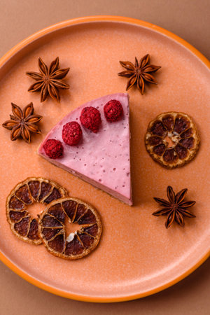 Raspberry or strawberry cheesecake, a slice of sweet red cake with berries.