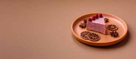 Raspberry or strawberry cheesecake, a slice of sweet red cake with berries. Raspberry cheesecake as...