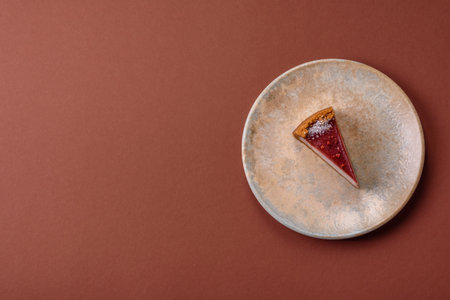 Strawberry cheesecake, a slice of sweet pie, a classic cheesecake dessert. Strawberry cheesecake as a food background for your design.の写真素材