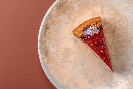 Strawberry cheesecake, a slice of sweet pie, a classic cheesecake dessert. Strawberry cheesecake as a food background for your design.の写真素材