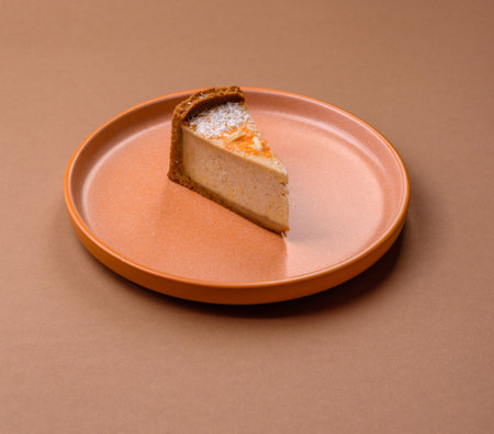 Cheesecake, a slice of sweet pie, a classic cheese dessert. Cheesecake as a food background for your...