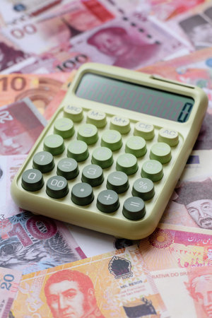 Calculator, money and expense calculations, tax form completion, and business budget concept preparation. Calculator, expense calculations as a financial background for your designの写真素材