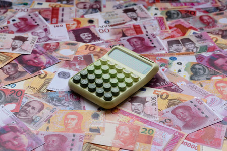 Calculator, money and expense calculations, tax form completion, and business budget concept...