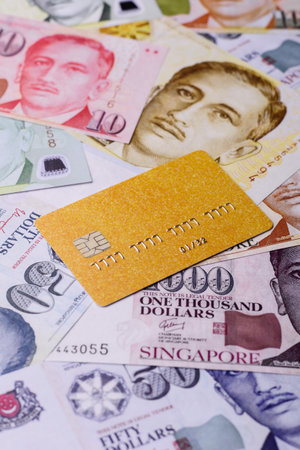 A credit card for contactless cashless payments via a terminal or online. A credit card for a financial backgroundの写真素材