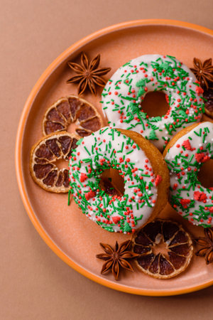 Christmas donuts or doughnuts, holiday winter sweets with chocolate filling and sprinkles. Christmas donuts or donuts as a food background for your design.の写真素材