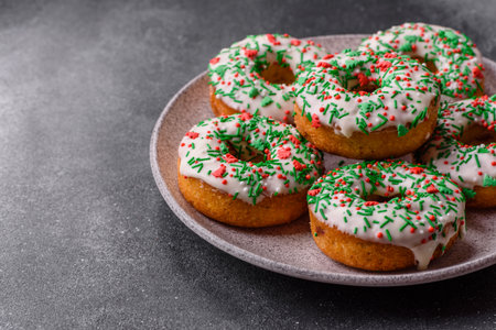 Christmas donuts or doughnuts, holiday winter sweets with chocolate filling and sprinkles. Christmas donuts or donuts as a food background for your design.の写真素材
