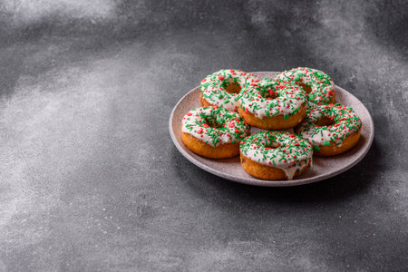 Christmas donuts or doughnuts, holiday winter sweets with chocolate filling and sprinkles. Christmas donuts or donuts as a food background for your design.の写真素材