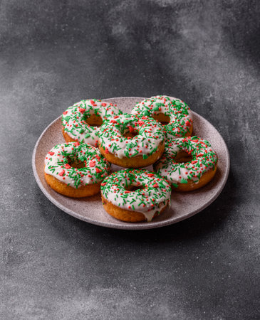 Christmas donuts or doughnuts, holiday winter sweets with chocolate filling and sprinkles. Christmas donuts or donuts as a food background for your design.の写真素材