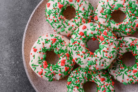 Christmas donuts or doughnuts, holiday winter sweets with chocolate filling and sprinkles. Christmas donuts or donuts as a food background for your design.の写真素材