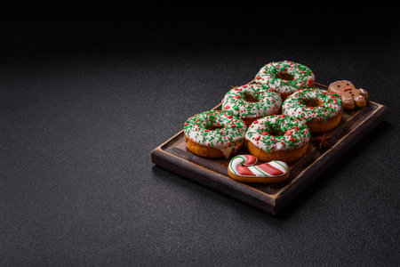 Christmas donuts or doughnuts, holiday winter sweets with chocolate filling and sprinkles. Christmas donuts or donuts as a food background for your design.の写真素材
