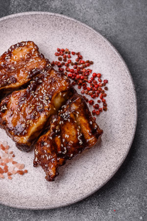 Grilled or bbq pork ribs with sauce, a food prepared for dinner. Grilled ribs as a food background for your designの写真素材
