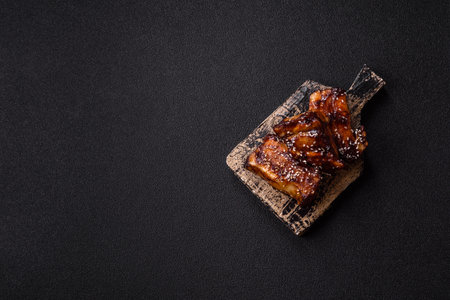 Grilled or bbq pork ribs with sauce, a food prepared for dinner.の写真素材