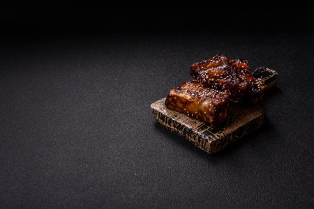 Grilled or bbq pork ribs with sauce, a food prepared for dinner.の写真素材